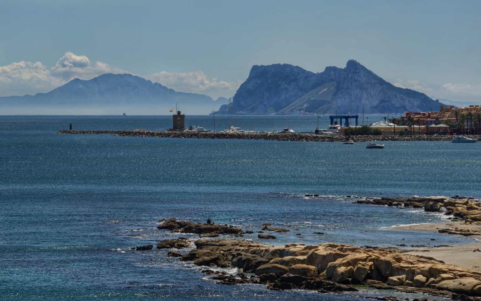 Puerto Sotogrande harbour entrance with Gibraltar in the distance